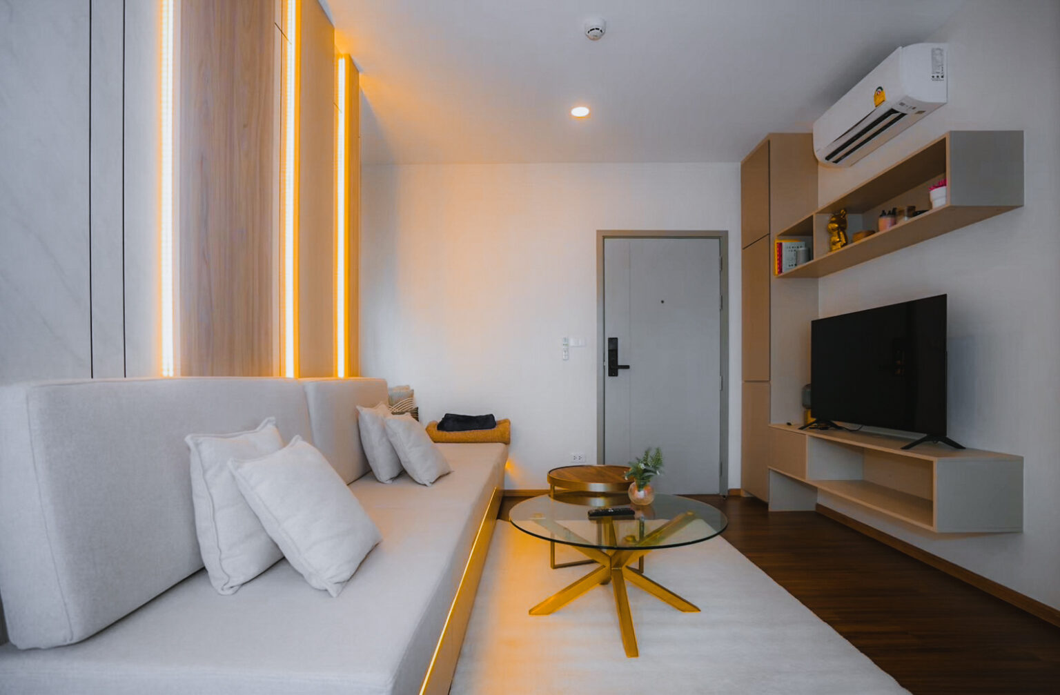 Condominium Interior living room design with custom built-in furniture and by Sketchbook Studio